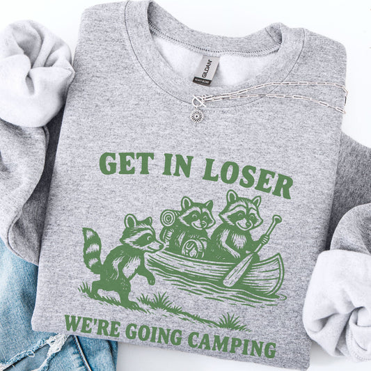 Gray sweatshirt with green graphic and text 'Get in loser, we're going camping' on a white background.