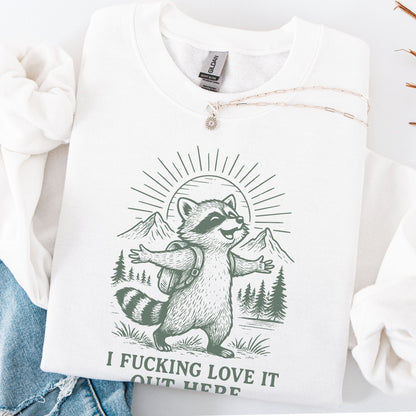 White sweatshirt with a raccoon graphic and text on a white background