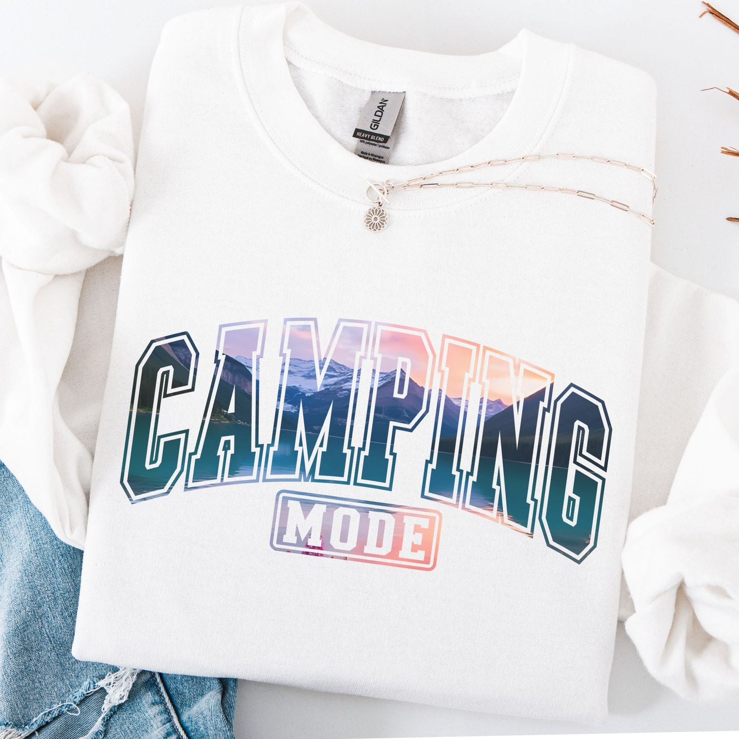 White sweatshirt with 'Camping Mode' graphic design on a white background