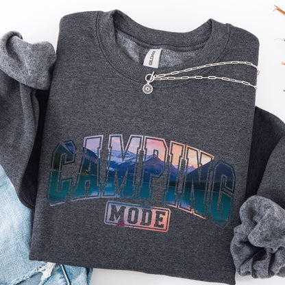 Dark gray sweatshirt with 'Camping Mode' graphic design on a white background