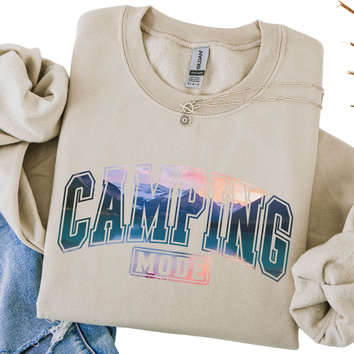 Beige sweatshirt with 'Camping Mode' text on a white background