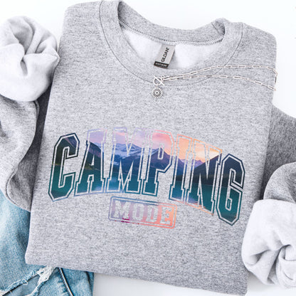Gray sweatshirt with 'Camping Mode' text and colorful design on a white background