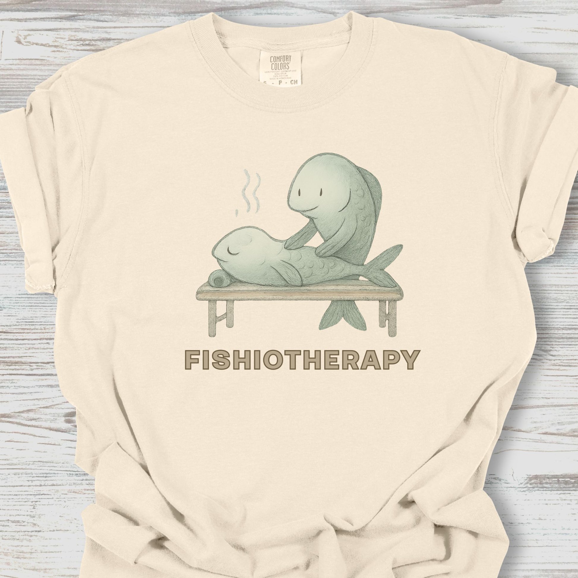 Beige t-shirt with 'Fishiotherapy' graphic featuring two fish on a table.