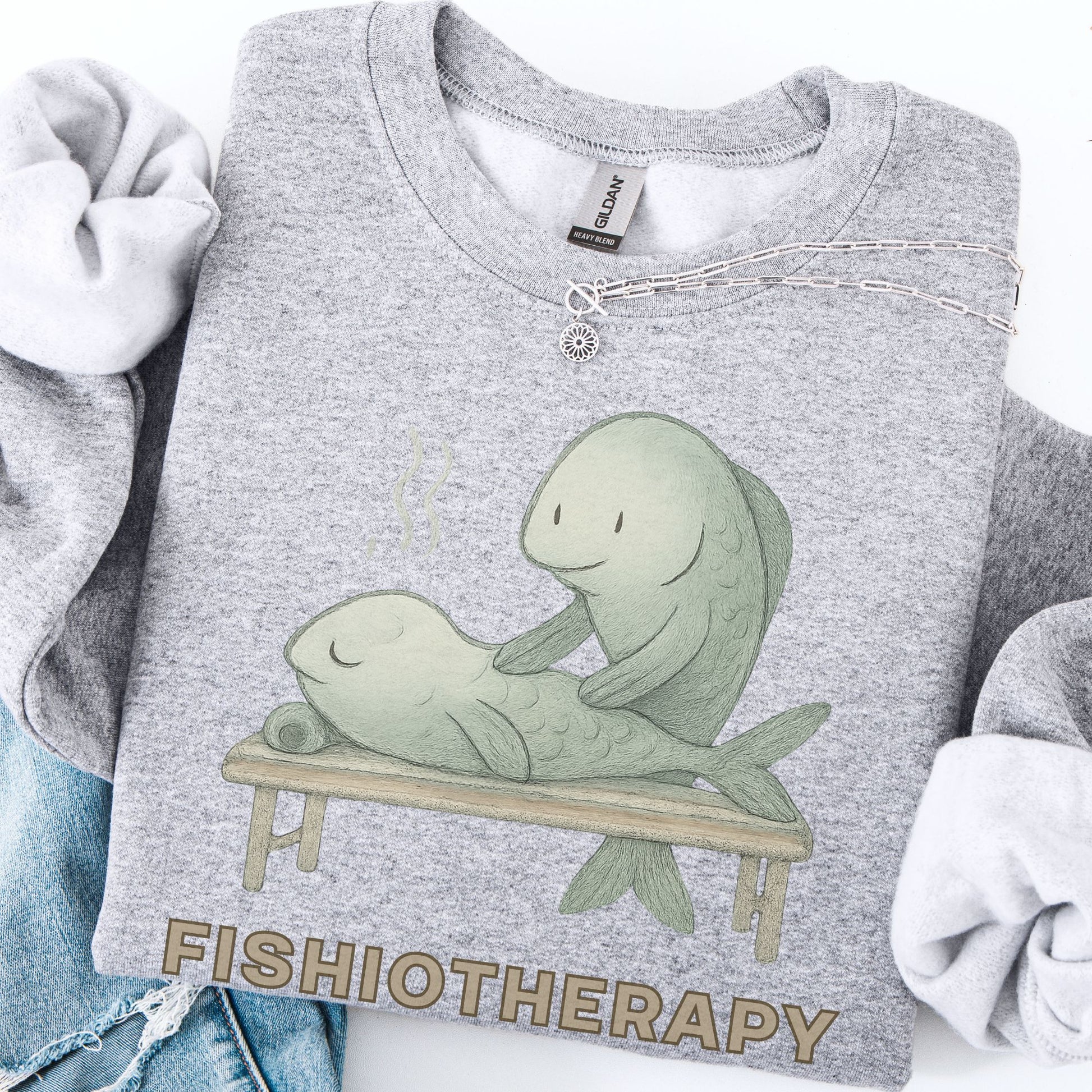 Gray sweatshirt with 'Fishiotherapy' design featuring two fish on a table.