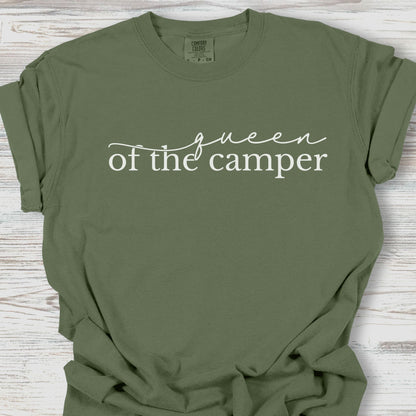 Green t-shirt with 'queen of the camper' text on a wooden surface