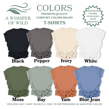 Collection of t-shirts in various colors with brand name 'A Whisper of Wild' displayed.