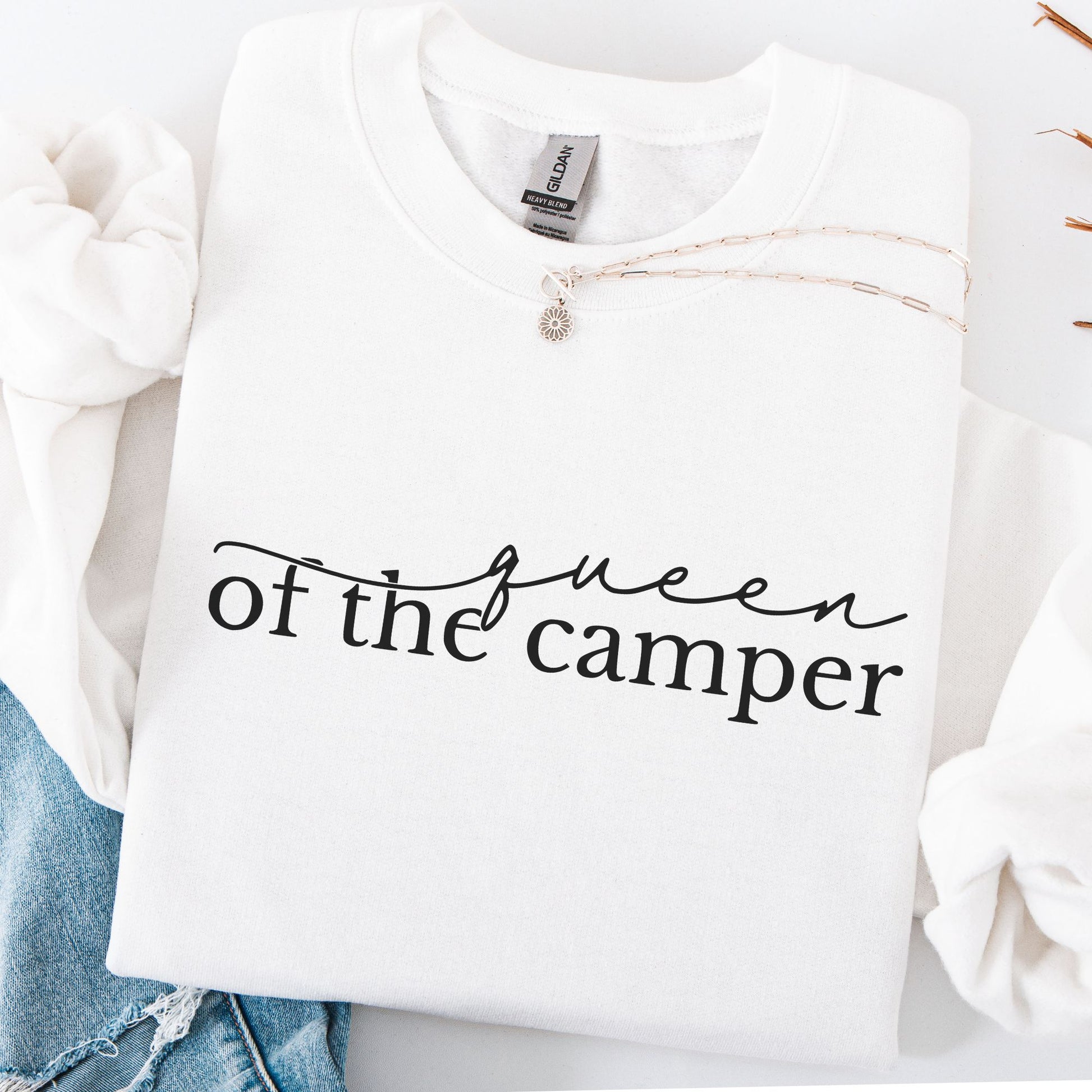 White sweatshirt with 'Queen of the Camper' text on a white background