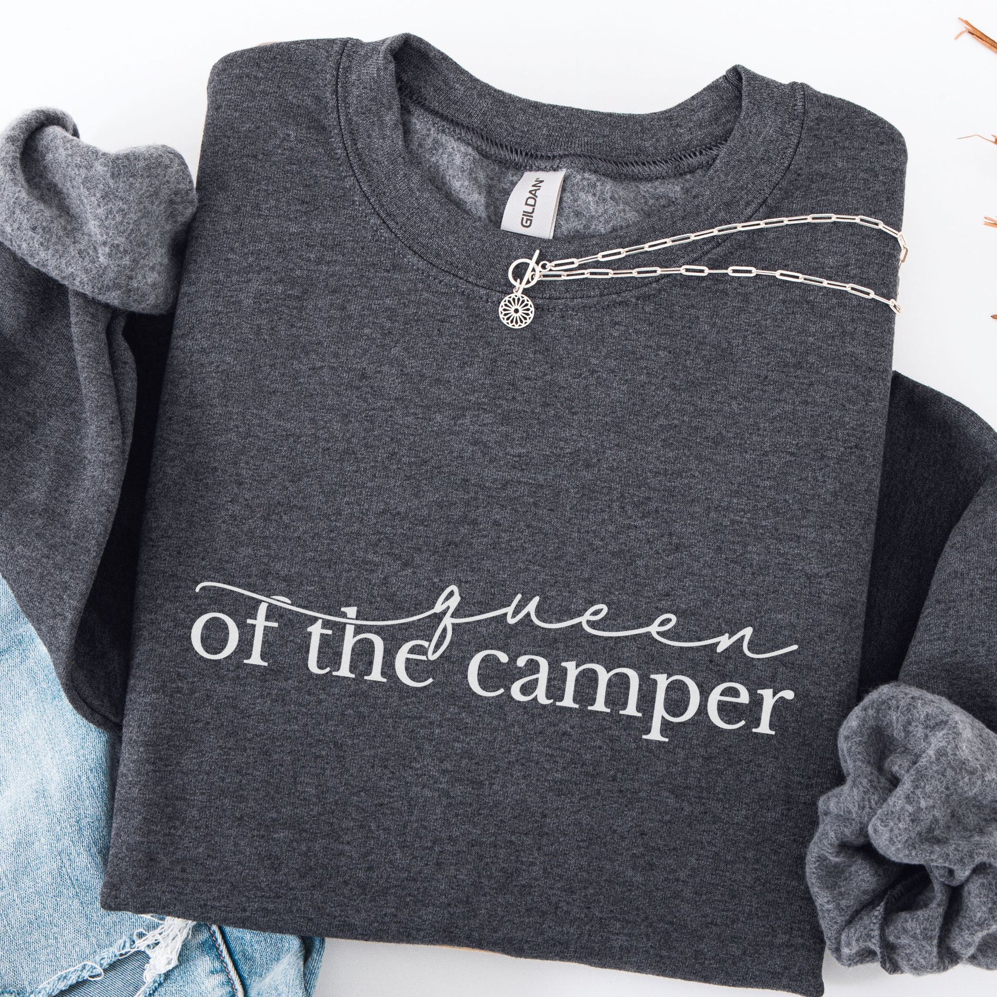 Dark gray sweatshirt with 'Queen of the Camper' text, displayed with denim jeans and a necklace.