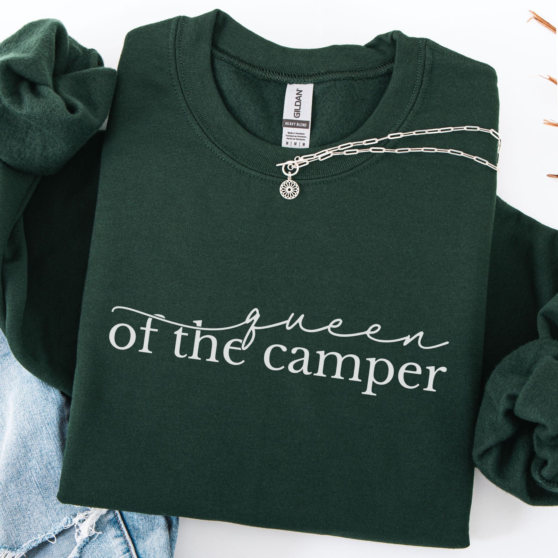 Green sweatshirt with 'Queen of the Camper' text, displayed with a chain necklace.