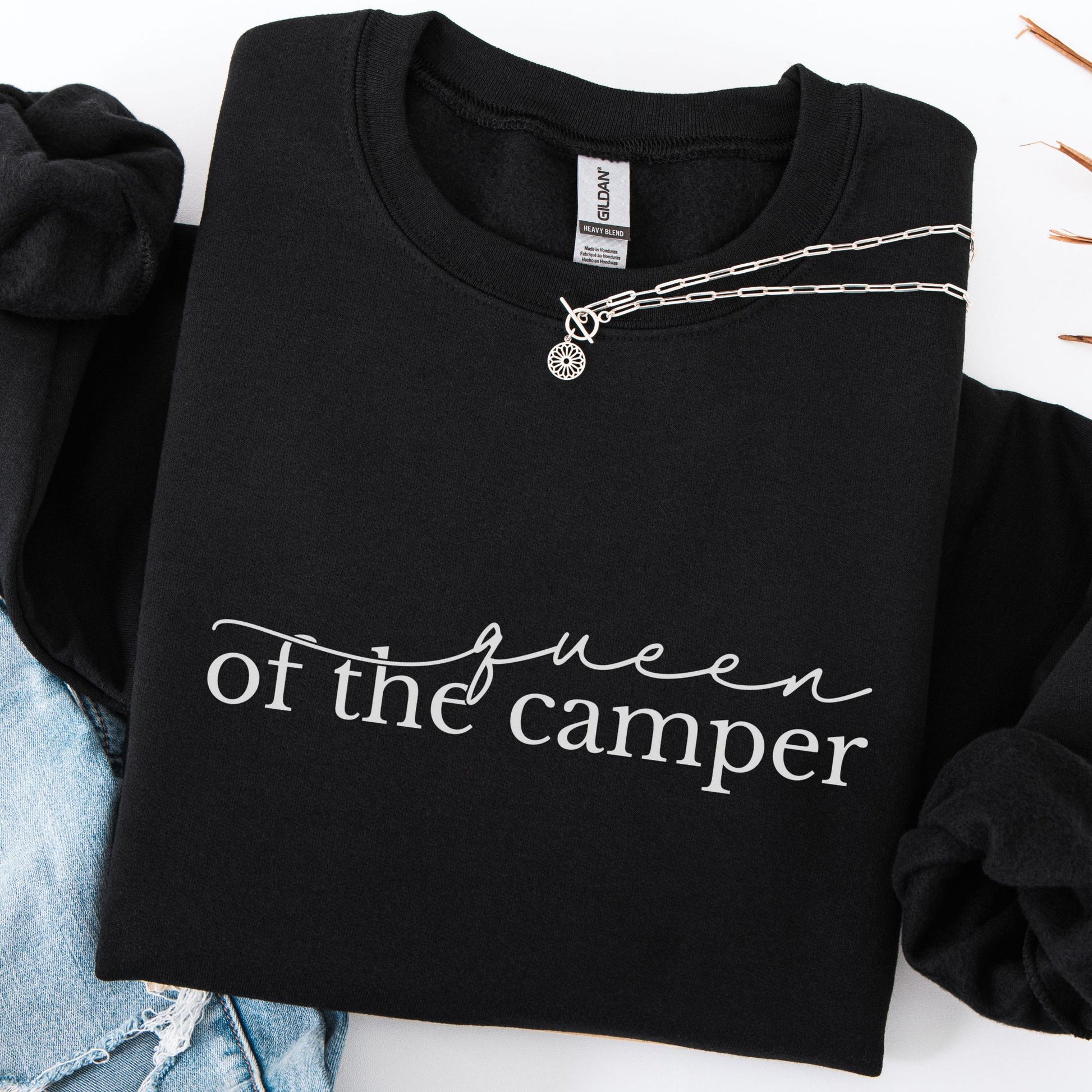 Black sweatshirt with 'queen of the camper' text on a white background