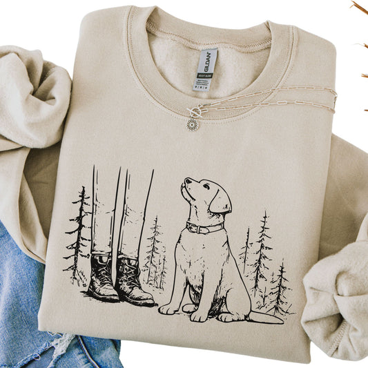 Beige sweatshirt with a dog and forest design on a white background