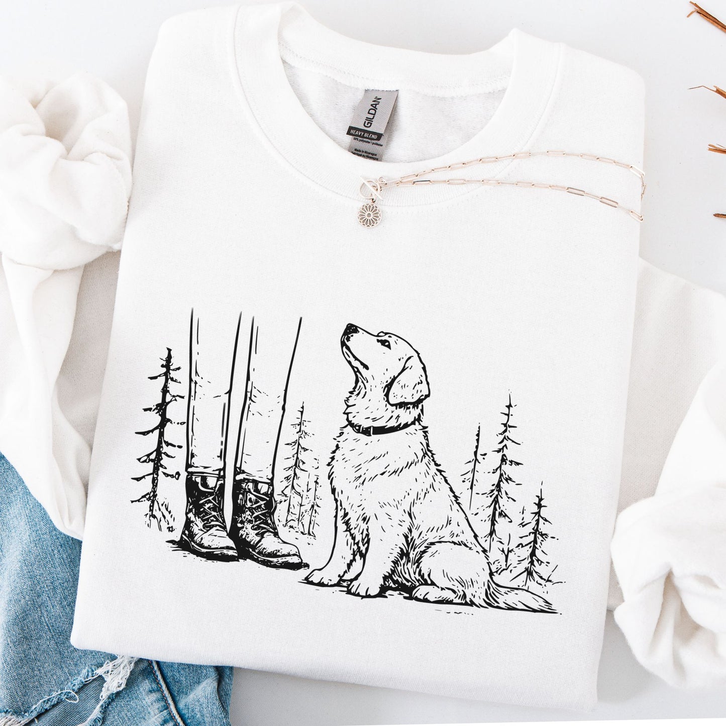 White sweatshirt with a black dog and forest design on a white background