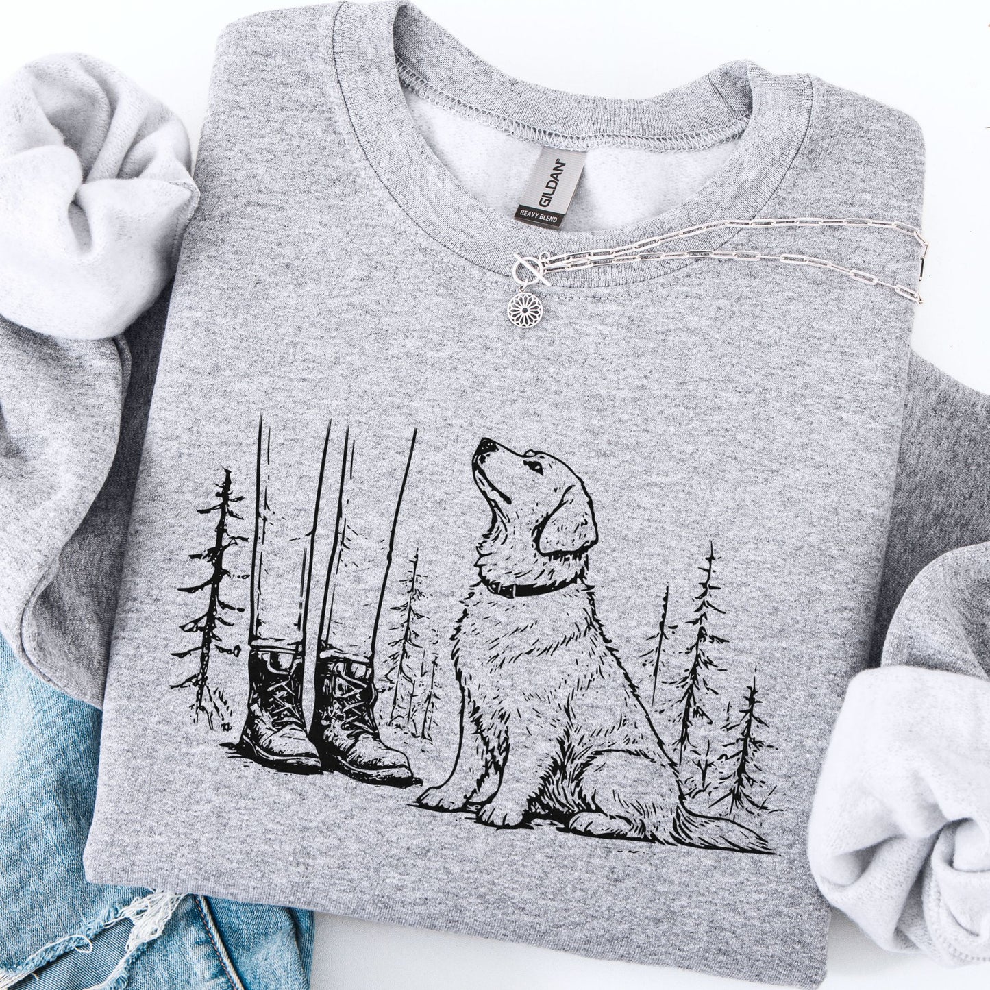 Gray sweatshirt with a dog and nature design on a white background
