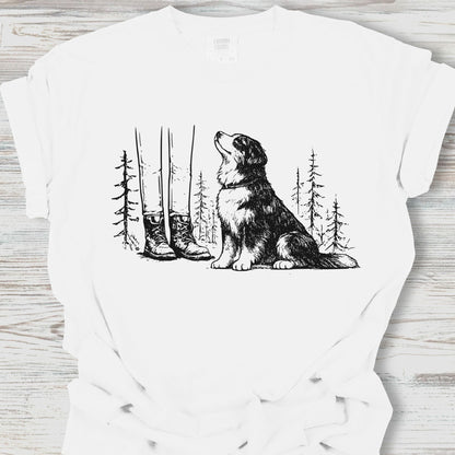 White t-shirt with a graphic of a dog howling at the moon with trees and boots in the background.