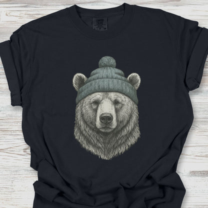 Black t-shirt with a bear wearing a beanie on a wooden surface