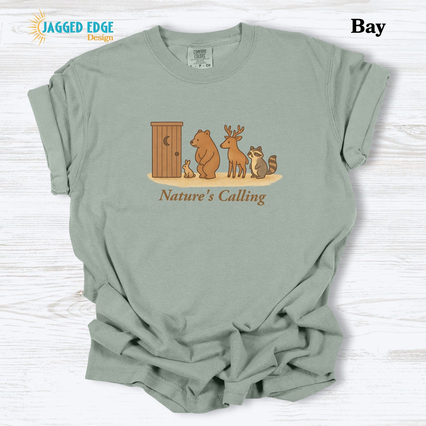 Light green t-shirt with 'Nature's Calling' graphic on a white background