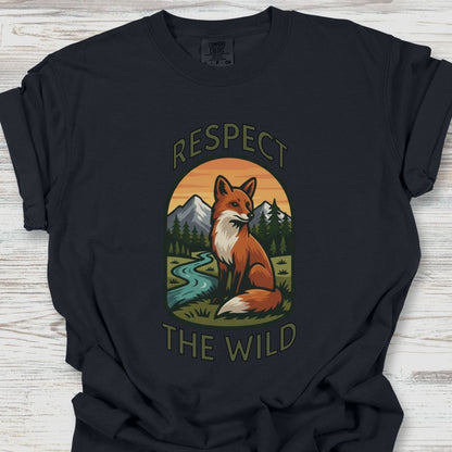 Black t-shirt with a fox graphic and 'Respect the Wild' text on a wooden surface