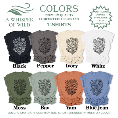 Collection of t-shirts in various colors with floral designs, branded as 'A Whisper of Wild'.