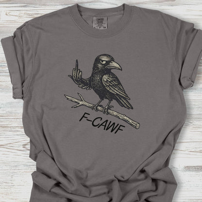 Gray t-shirt with a crow graphic and 'F-CAWF' text on a wooden surface