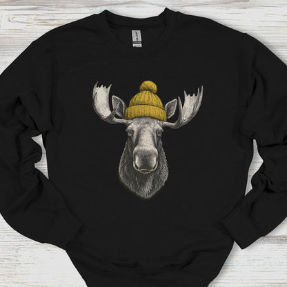 Black sweatshirt with a moose wearing a yellow beanie on a wooden surface