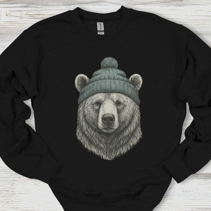 Black sweatshirt with a bear wearing a beanie on a wooden surface