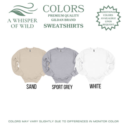 Three sweatshirts in sand, sport grey, and white with brand logos and text on a white background.