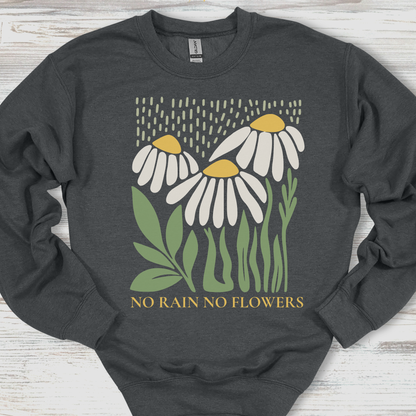 Dark gray sweatshirt with floral design and 'No Rain No Flowers' text on a wooden surface