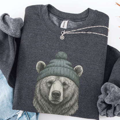 Dark gray sweatshirt with a bear wearing a green beanie design, displayed with a necklace.