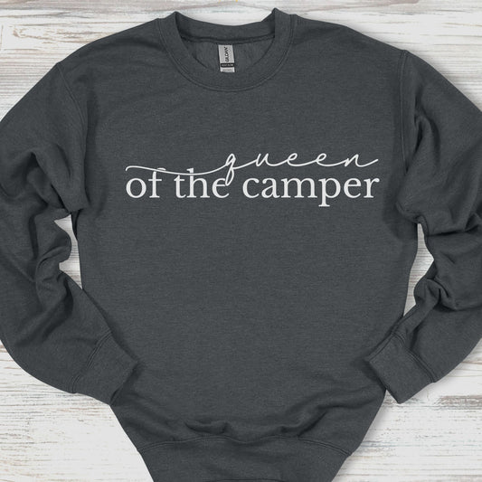 Dark gray sweatshirt with 'queen of the camper' text on a wooden surface
