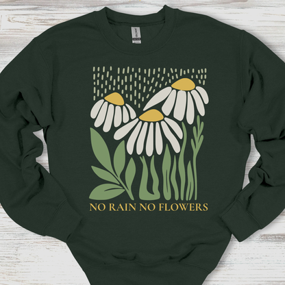 Dark green sweatshirt with floral design and 'No Rain No Flowers' text on a wooden surface