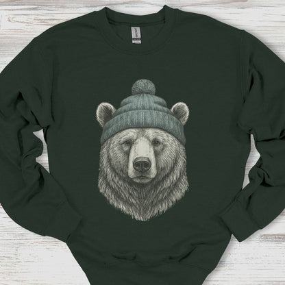 Black sweatshirt with a bear wearing a green beanie on a wooden surface