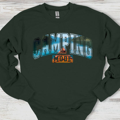 Black sweatshirt with 'Camping Mode' graphic on a wooden surface