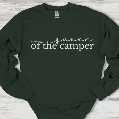 Black sweatshirt with 'queen of the camper' text on a wooden surface