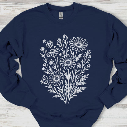 Navy blue sweatshirt with white floral design on a wooden surface