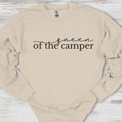 Beige sweatshirt with 'Queen of the Camper' text on a wooden surface