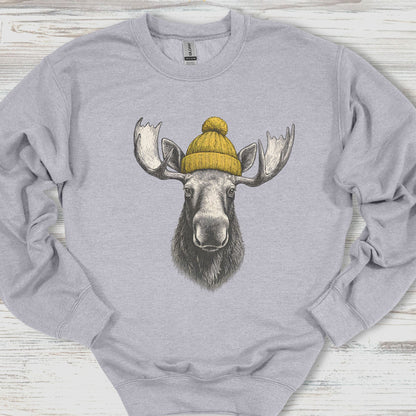 Gray sweatshirt with a moose wearing a yellow beanie on a wooden surface