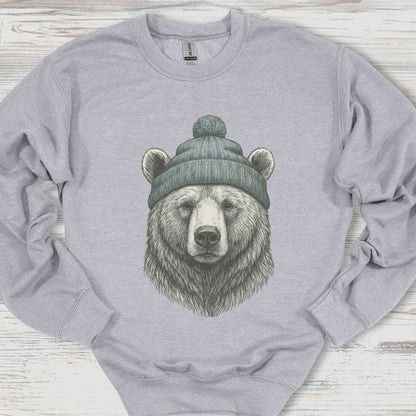 Gray sweatshirt with a bear wearing a beanie on a wooden surface