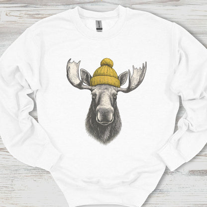 White sweatshirt with a moose wearing a yellow beanie on a wooden surface