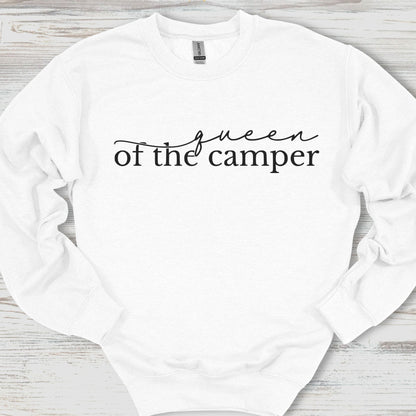 White sweatshirt with 'queen of the camper' text on a wooden surface