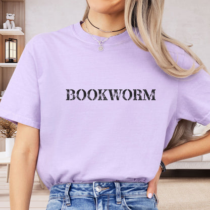 a woman wearing a purple shirt that says bookworm